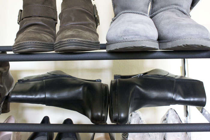 Lay shorter boots on their side to fit them on lower shelves