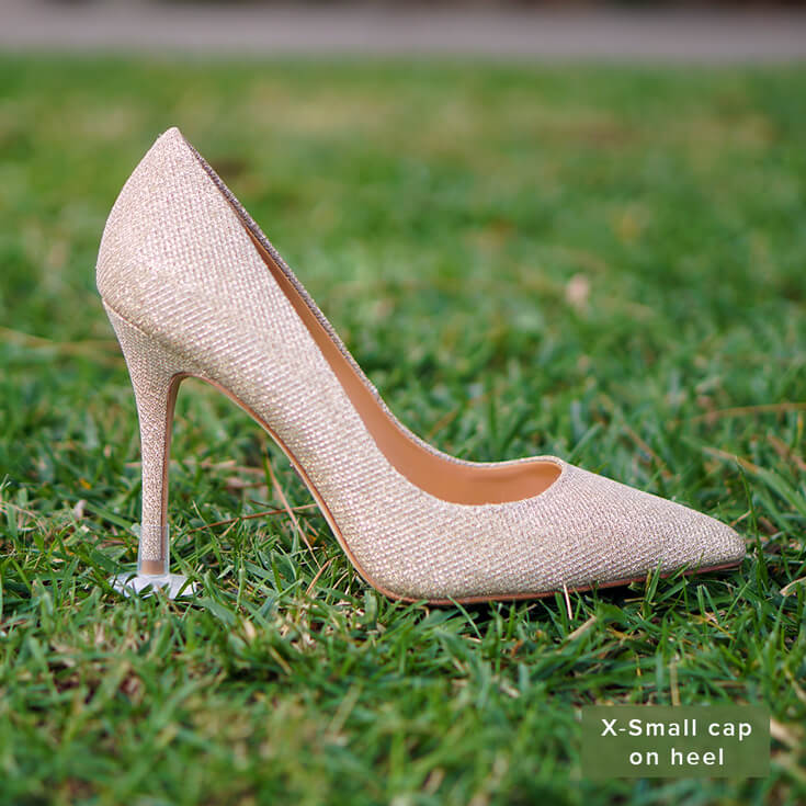 STOPPERS heel protector on gold heels on grass